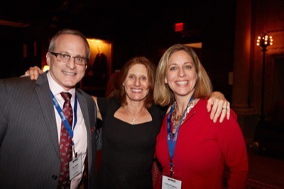 Sun Broadcast Group SVP/Programming & Affiliate Relations Ron Rivlin (l) poses with Compass Media Networks VP/Affiliate Sales & Content Nancy Abramson and AdLarge Media President Cathy Csukas.