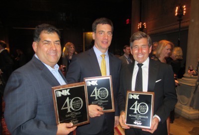 CBS Radio COO Scott Herman and Entercom CEO David Field (who have momentarily traded plaques) pose with iHeartMedia President/COO/CFO Richard Bressler.